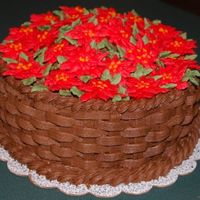 Poinsettia Basket Chocolate buttercream basketweave with buttercream poinsettias. 8" cake.
