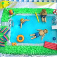 Pool Party Made for a joint 5th birthday party for my son and two friends who share the same birthday.All accessories made out of fondant.