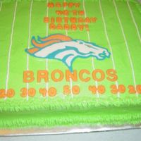 Broncos Cake I saw this on here, thank you to whomever you are, sorry I cant remember! It was half choc, half yellow, buttercream frosting with candy...