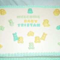 Baby Shower Yellow cake frosted in buttercream with candy melt mold decorations.