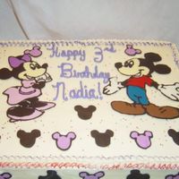 Mickey And Minnie Mouse This was a cake I made for my niece in June. Its half choc half yellow with candy melt decorations.