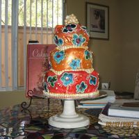 Img_1356.jpg This cake is covered in white fondant, I drew the flowers on and handpainted the entire cake. I thought it looked great. Thanks for looking...