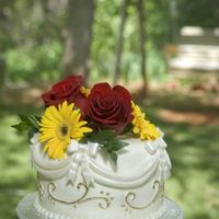 Sepul Wedding2 Close-up of top tier with fresh flowers. Pictures downloaded earlier without flowers.