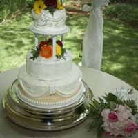 Sepul Wedding Fondant covered cake, shown earlier without flowers. Dramatically awesome after flowers are added. It's amazing what the flower can do...