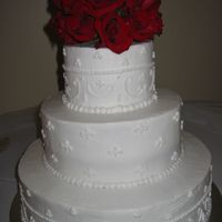 White Scrolls I did alright for not favoring working with BC on this wedding cake. Bride provided picture of cake desired. Simple scrolls.