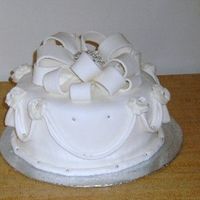 Resized_Elegant_Cake_4.jpg This is cake #4 for me. Just a practice cake. First time making a fondant bow. It should have been fuller but I ran out of fondant.