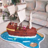 Peter Pan Pirate Ship This cake was done as a dummy....to be looked at by the party goers. The ship was carved by a professional styro carver and then the rest (...