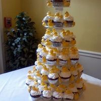 Chocolate Rubber Duckie Cupcake Tower! Red Velvet cupcakes topped with buttercream icing and molded chocolate rubber duckies.
