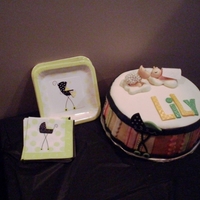 Baby And Sheep Baby Shower Cake buttercream/fondant covered cake, fondant/gumpaste decorations & figures, custom matched to baby shower decorations.