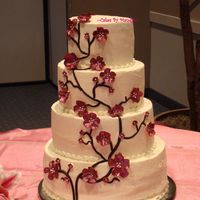 Claret Colored Cherry Blossom Cake This cake gave me fits......the buttercream would not smooth!!! Then I got one of those crazy airbubble things that formed under the...