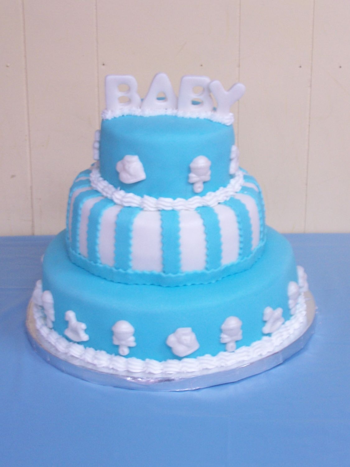 Baby Shower Cake Made this for my DH's niece. French vanilla with lemon curd and raspberry filling covered with fondant. All the decorations are also...
