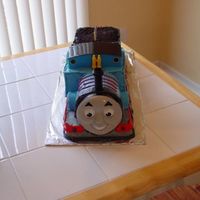 Thomas The Train Birthday Cake Cake for my son's 3rd birthday. He is a huge Thomas fan. Thomas engine with coal car behind.