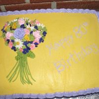 Grammie's Garden Bouquet This is a cake I made for my Grandmother's 80th Birthday Party. It is a 1/2 sheet cake, iced in buttercream with royal icing flowers....