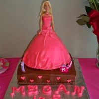 Megan's 5Th Birthday Barbie doll done for granddaughters birthday. Only second time to cover a cake with fondant.