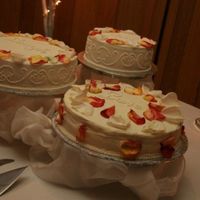 2Nd Wedding Cake 1 chocolate w/ mocha filling , 1 vanilla w/ mocha filling both covered in buttercream. The 3rd is a carrot cake w/ cream cheese icing. (I...