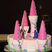 1St Princess Castle Cake White cake with chocolate filling covered in bc icing. Towers are ice cream cones covered in bc-turrets are ice cream cones covered in pink...