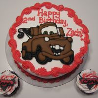 Mater Buttercream iced cake and cupcakes with color flow mater and Cars logo.