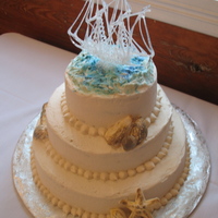Sailboat Theme Sailboat, seashells accent this 3 - tiered cake.