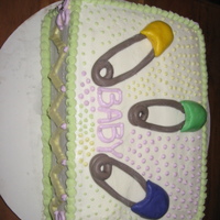Diaper Pins Cake Fondant diaper pins and buttercream icing and decorating.