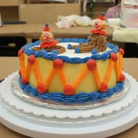 My Clown Cake Icing was a little too thin so the cake is kinda messy looking. Still trying to get that shell border, it's definitely harder than it...