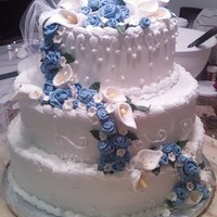 Calla And Rose Wedding Cake Had fun making this one. I just don't like frosting chocolate cake...once I got past that.....I was all set!!!!!! Layers are 9 - 12 -...