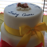 Babies And Bows Strawberry cake with Fondx fondant. Peanut Butter candy melt baby.