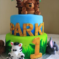 Jungle Animals This was based off a picture the client showed me. Choc cake with Fondx fondant, airbrushed tiers, and fondant animals. The lion was my...