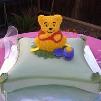 Pooh Pillow Cake Chocolate cake with buttercream and peanutbutter mousse filling. Done for a Friend and her 1st Baby