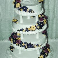 Wedding_Cake.jpg I made this for my best friend. We had a 40C day, the cream was starting to melt and almost colected the cake from under the table. It fell...