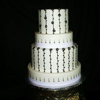 Black & White Round Wedding Buttercream frosting w/ black royal piping, mini fondant flowers