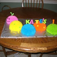Catepillar Cake This is my take on the Wilton's catepillar cake. Made for a friend's baby's first birthday. It is white cake with...