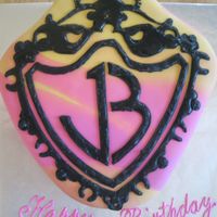 Jonas Brothers Cake Covered in pink and yellow marbled fondant. Logo done with royal icing.