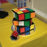 Rubik's Cube 80's themed birthday party cake. All fondant touched up with airbrush.