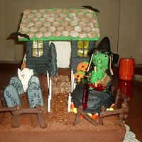 Witch House Birthday cake for coworkers,bc icing,chocolate covered pretzels for fence, fondant witch,graham cracker house.