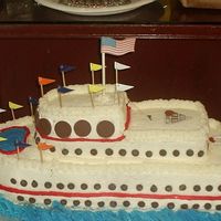 Cruise Ship mother in laws 86th birthday ! white cake with buttercream , choc chips for windows flags ,shuffle board , and life preserver are scrapbook...