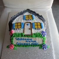 House Cake This cake was created for a customer's friends housewarming. I wasn't too pleased with the colour scheme I used.Used Wilton House...