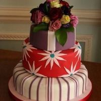 3 Tier Triple Celebration Cake This was made for an anniversary / birthday / graduation celebration. All sugarpaste on fruit / chocolate / buttemilk cakes, apart from the...