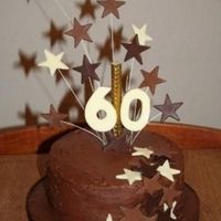 60Th Birthday Cake Chocolate fudge cake with Ganache filling and covering. Stars and numbers are made from cocoform.