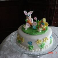 Bunnie Cake This is a cake with fondant fiqures on it. It was my first time at this.