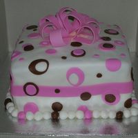 Polk A Dots Chocolate Cake with butter cream icing and fondant. Polk a Dots and a fancy bow. The bride loved it.