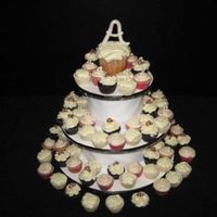 King And I King cuppy with 100 minis in 3 flavors. Letter As in chocolate and big one in fondant. First attempt at my own stand.