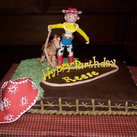 Cowgirl Cake Chocolate cake, Chocolate Bavarian filling, Chocolate Buttercream Icing, Gumpaste cowgirl, horse, bandana, rope and lettering. Figures are...