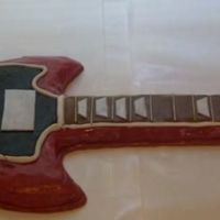 Nick Jonas Guitar Camp Rock Guitar cake for my 12 year old daughter. Marble cake hand carved covered in mmf and mc. Hardest cake I have done so far, but very...