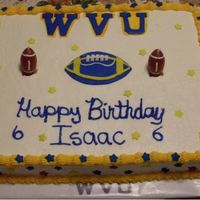 Wvu Football Cake I did this for a friend's 6 year old son. He loves the mountainers. Chocolate w sfr icing and candy accents. Letters and ball cut from...