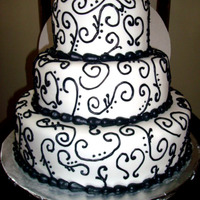 Valentines Wedding Cake! 3 tiered (6,9,12) round cake with fondant icing and black buttercream hand-piped swirls and border!