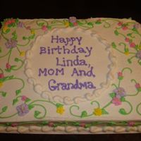 Spring Flower Birthday Cake! This is a half sheet WASC cake with vanilla buttercream frosting and I just did many vines and swirls with leaves and spring like flowers...