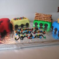 Train Birthday Cake Front view of train. I used mini loaf pans and for the engine I used oreo cookies on top of the cake to make the circular front part....