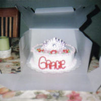 Tiara Covered in buttercream and name done in fondant. Toy tiara.