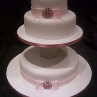 Pink Sparkly Wedding Cake With Diamontes A very simple wedding cake with non-edible diamonte brooches