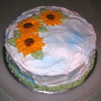 Sunflower Sky this was an experimental cake for me. I tried using the blue spray mist for sky and i attempted to make sunflowers.. they turned out...